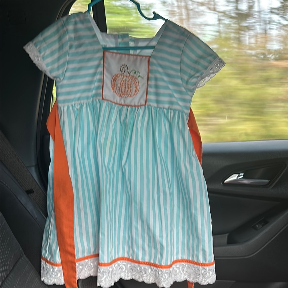Fall dress. Aqua and white strips with orange detail.